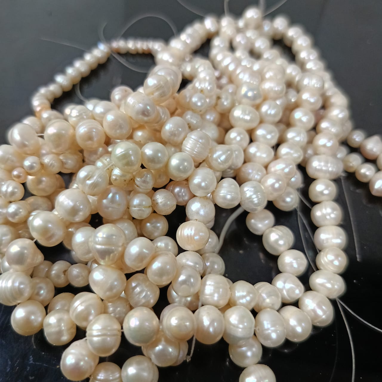 09 عقود لؤلؤ طبيعي مفتوحة