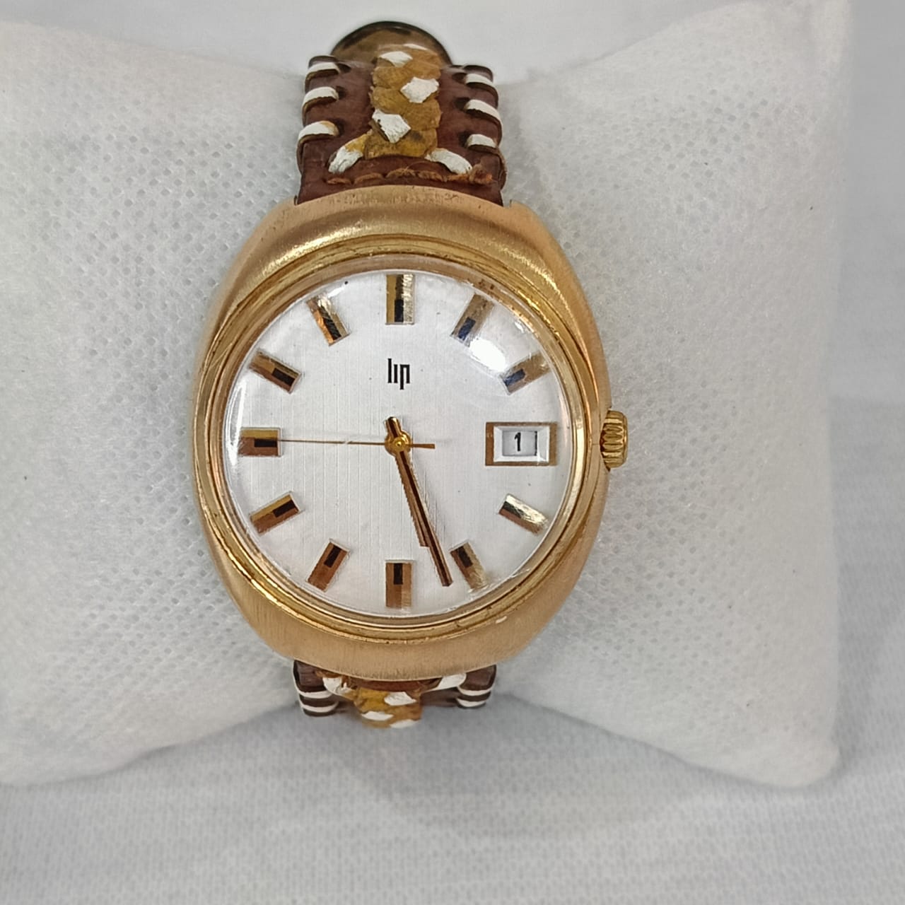 Montre lip elcto-mécanique en plaqué or