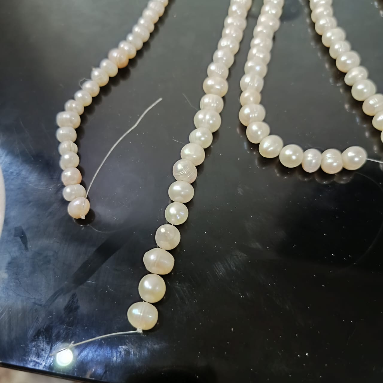 09 عقود لؤلؤ طبيعي مفتوحة